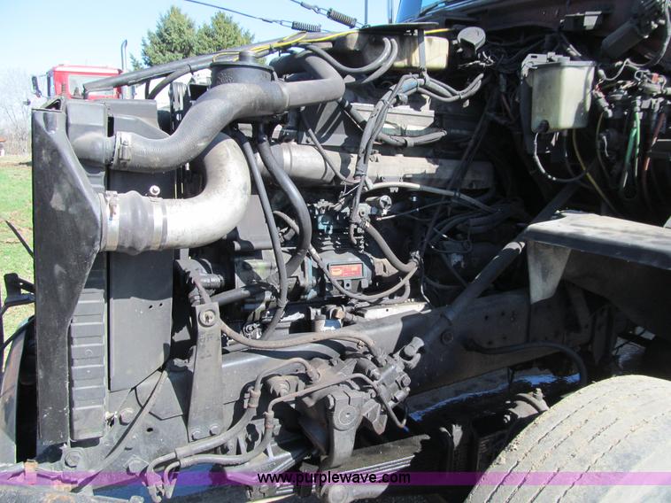 image for item E4718 1993 Ford LTL9000 tri axle semi truck