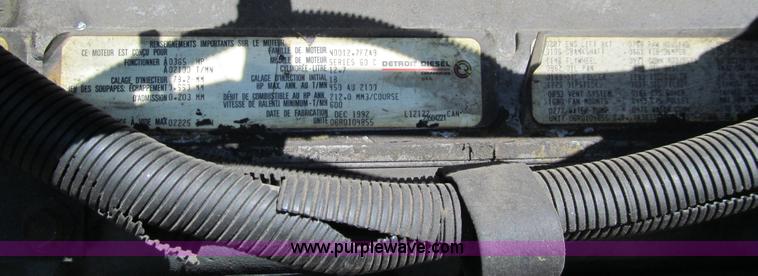 image for item E4718 1993 Ford LTL9000 tri axle semi truck