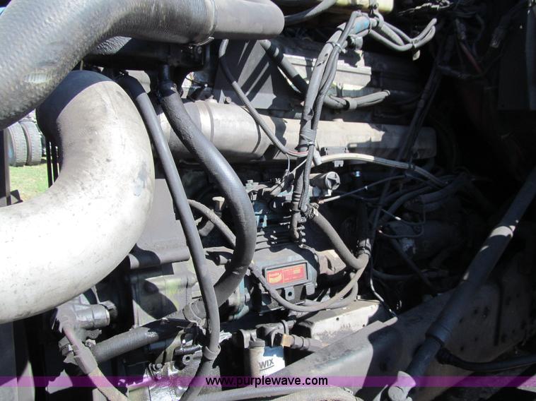 image for item E4718 1993 Ford LTL9000 tri axle semi truck