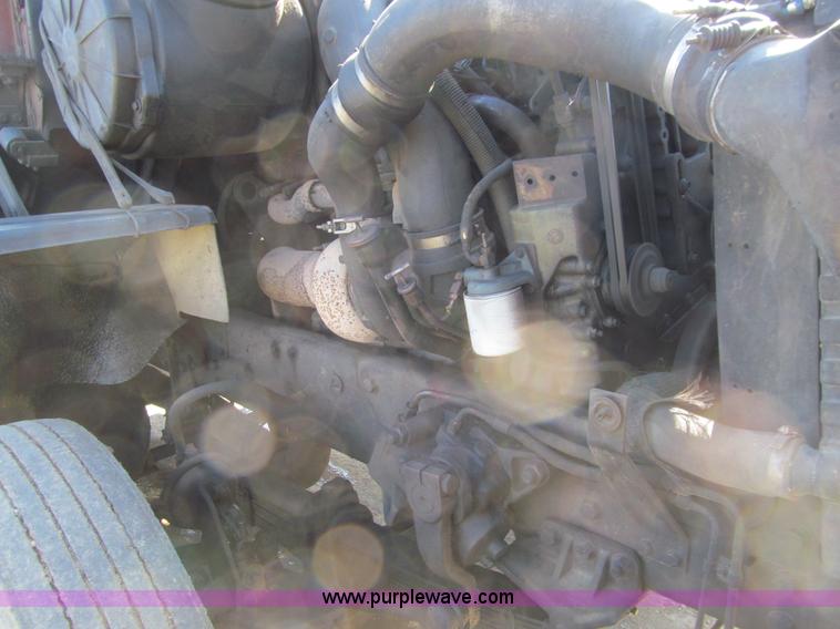 image for item E4718 1993 Ford LTL9000 tri axle semi truck