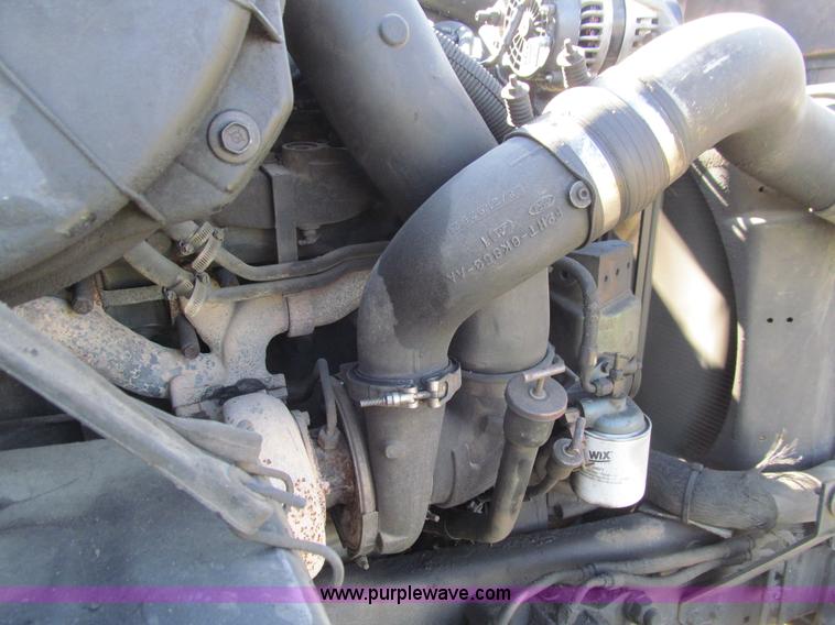 image for item E4718 1993 Ford LTL9000 tri axle semi truck