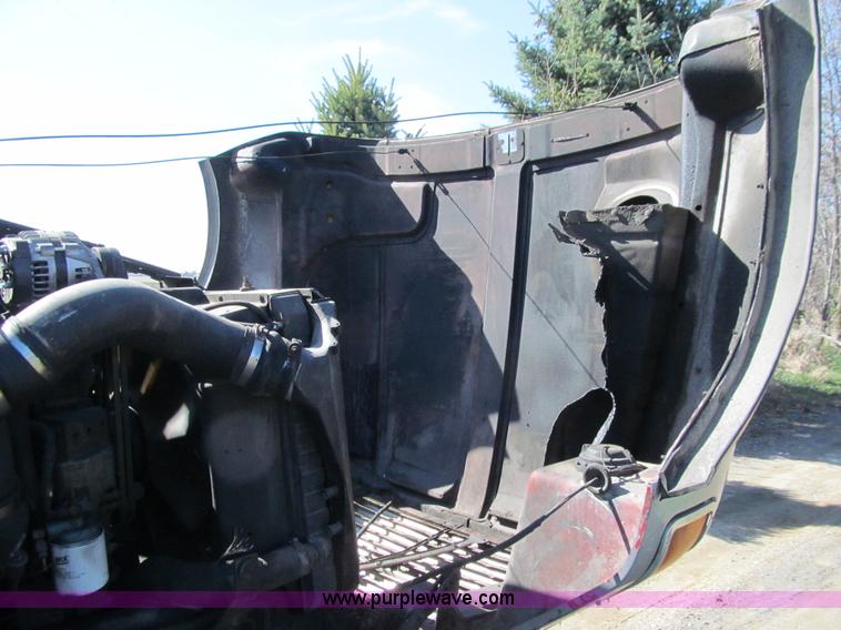 image for item E4718 1993 Ford LTL9000 tri axle semi truck