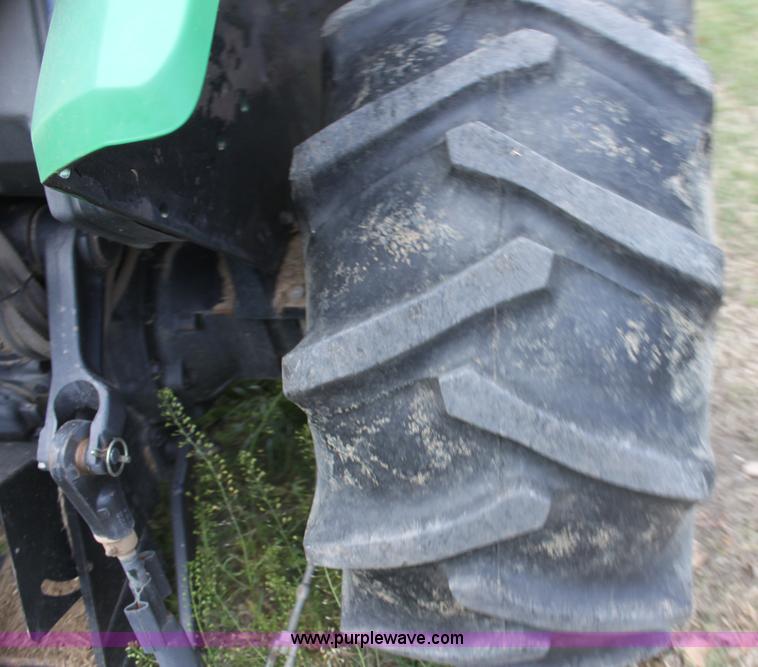 image for item H2066 1995 John Deere 5400 MFWD tractor