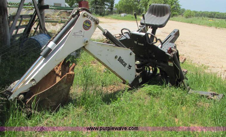 image for item G9301 Bobcat 8709 skid steer backhoe attachment