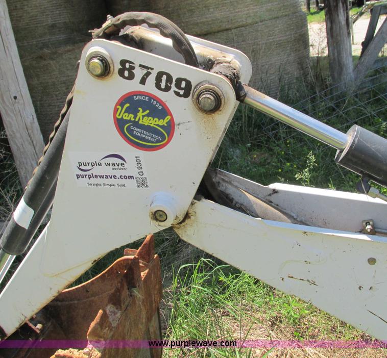 image for item G9301 Bobcat 8709 skid steer backhoe attachment