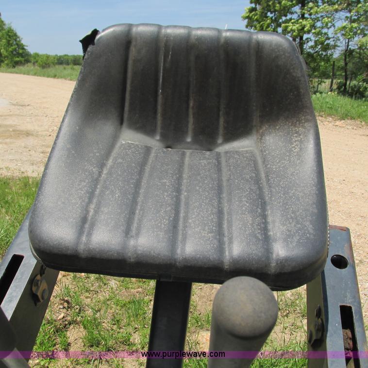 image for item G9301 Bobcat 8709 skid steer backhoe attachment