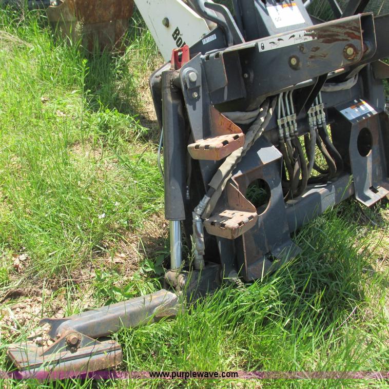 image for item G9301 Bobcat 8709 skid steer backhoe attachment