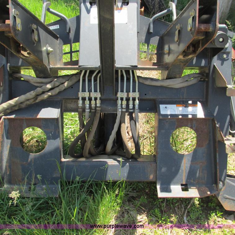 image for item G9301 Bobcat 8709 skid steer backhoe attachment