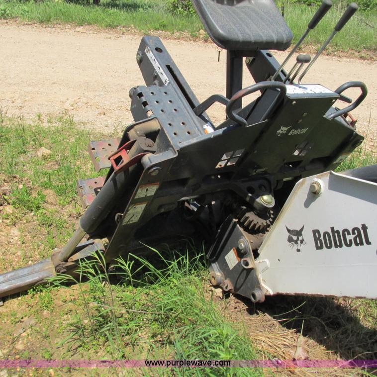 image for item G9301 Bobcat 8709 skid steer backhoe attachment
