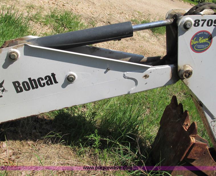 image for item G9301 Bobcat 8709 skid steer backhoe attachment