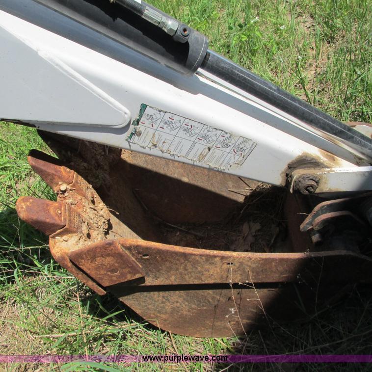 image for item G9301 Bobcat 8709 skid steer backhoe attachment