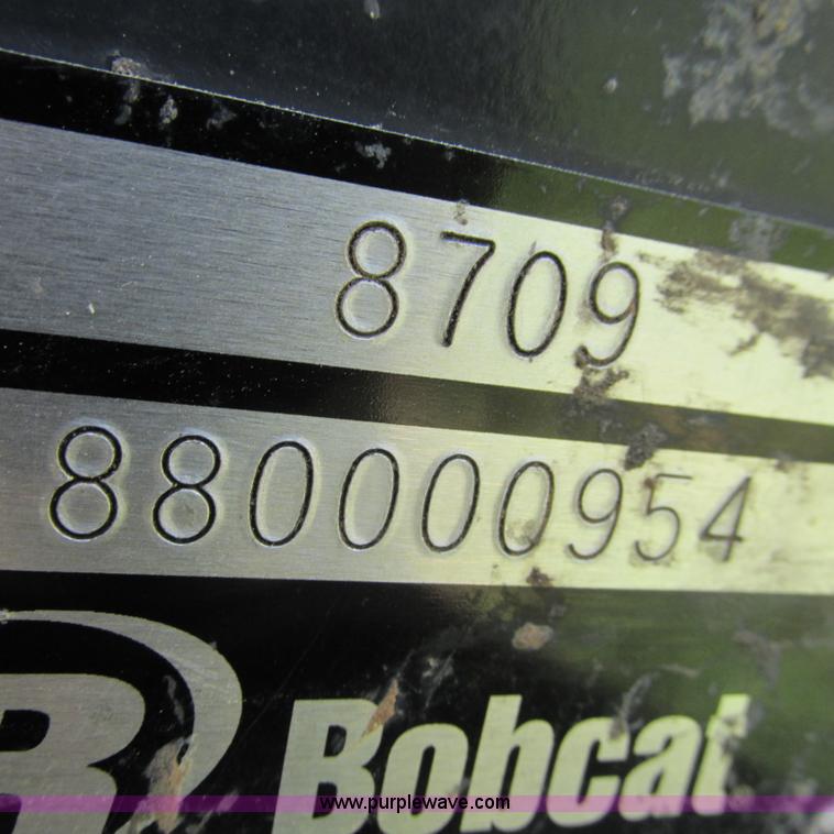 image for item G9301 Bobcat 8709 skid steer backhoe attachment