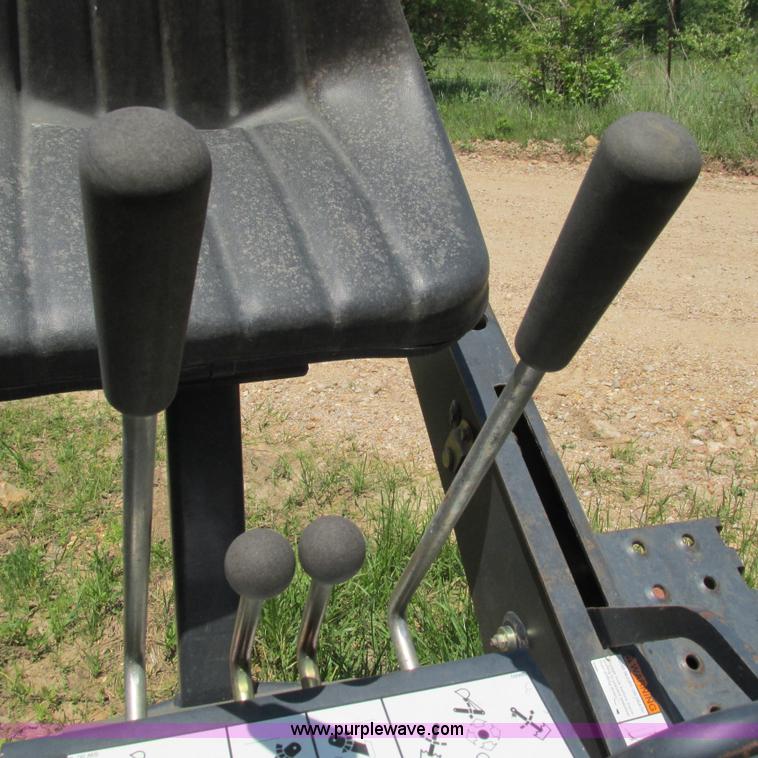 image for item G9301 Bobcat 8709 skid steer backhoe attachment