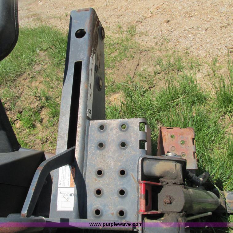 image for item G9301 Bobcat 8709 skid steer backhoe attachment