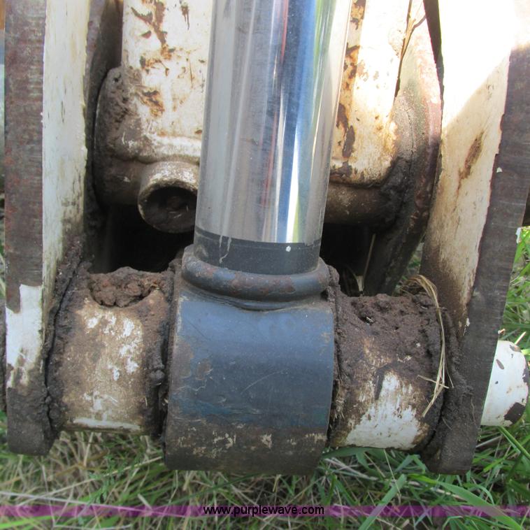 image for item G9301 Bobcat 8709 skid steer backhoe attachment