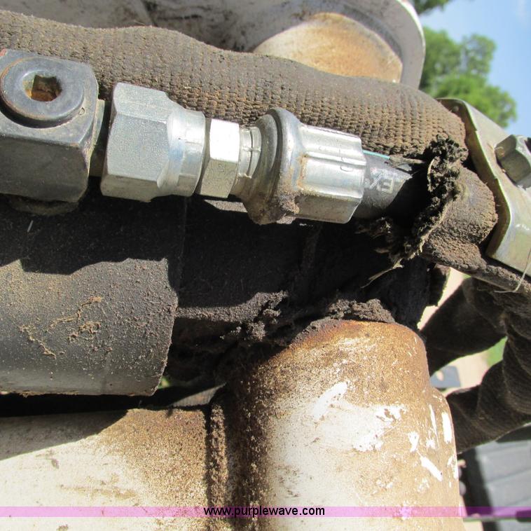 image for item G9301 Bobcat 8709 skid steer backhoe attachment