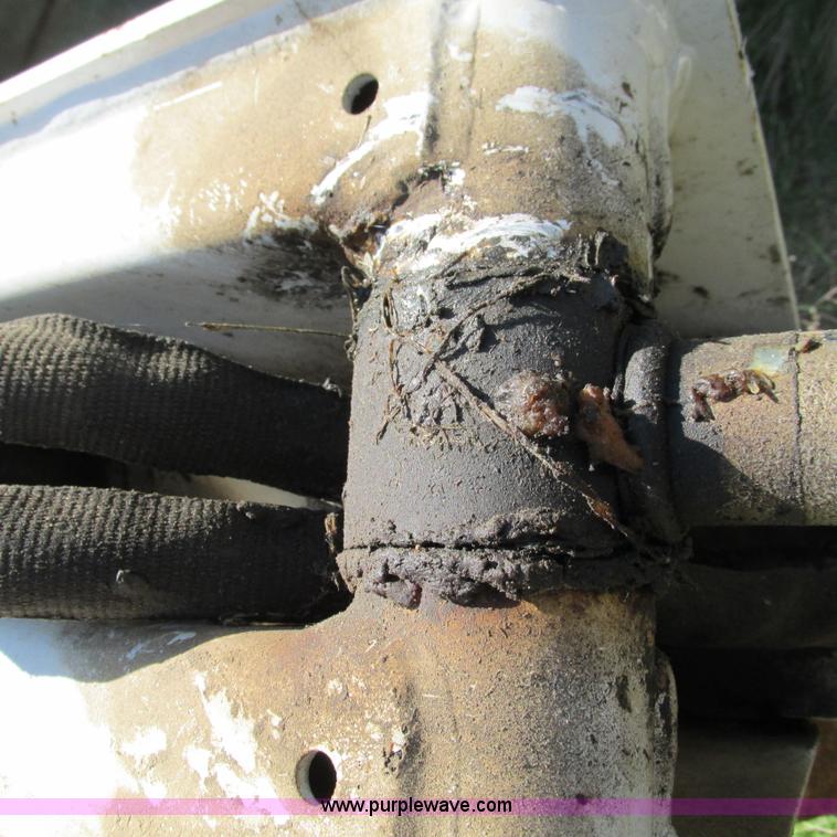 image for item G9301 Bobcat 8709 skid steer backhoe attachment