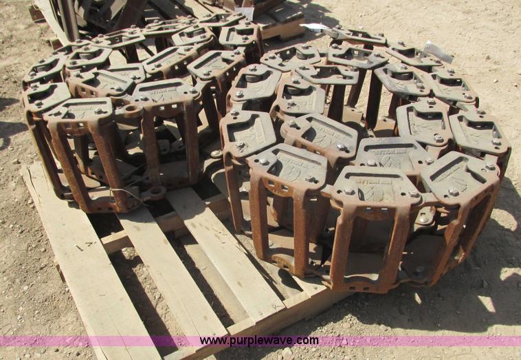 image for item I3972 New Holland steel grouser skid steer tracks