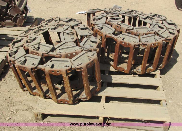 image for item I3972 New Holland steel grouser skid steer tracks
