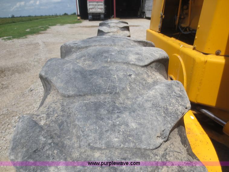 image for item F6999 1984 John Deere 570A articulated motor grader