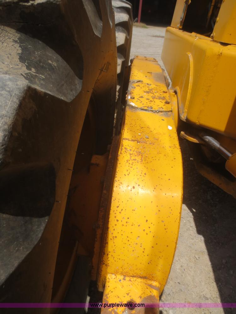 image for item F6999 1984 John Deere 570A articulated motor grader