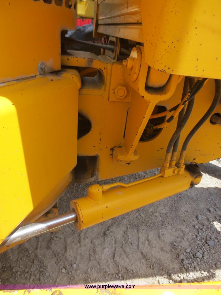 image for item F6999 1984 John Deere 570A articulated motor grader