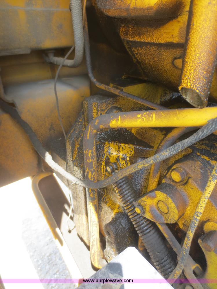 image for item F6999 1984 John Deere 570A articulated motor grader