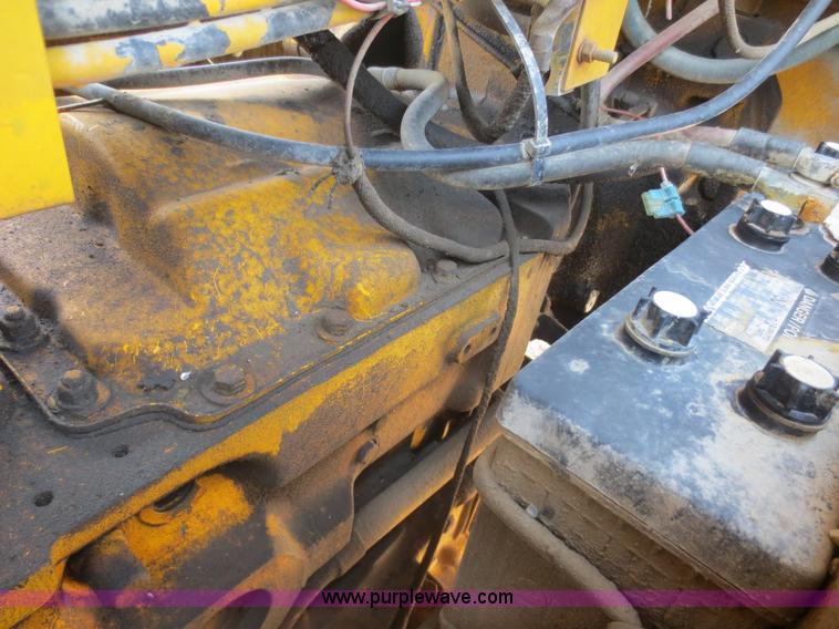 image for item F6999 1984 John Deere 570A articulated motor grader