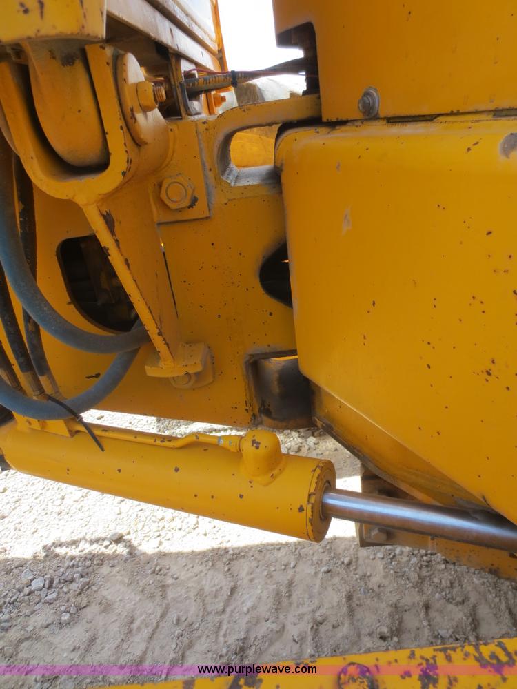 image for item F6999 1984 John Deere 570A articulated motor grader