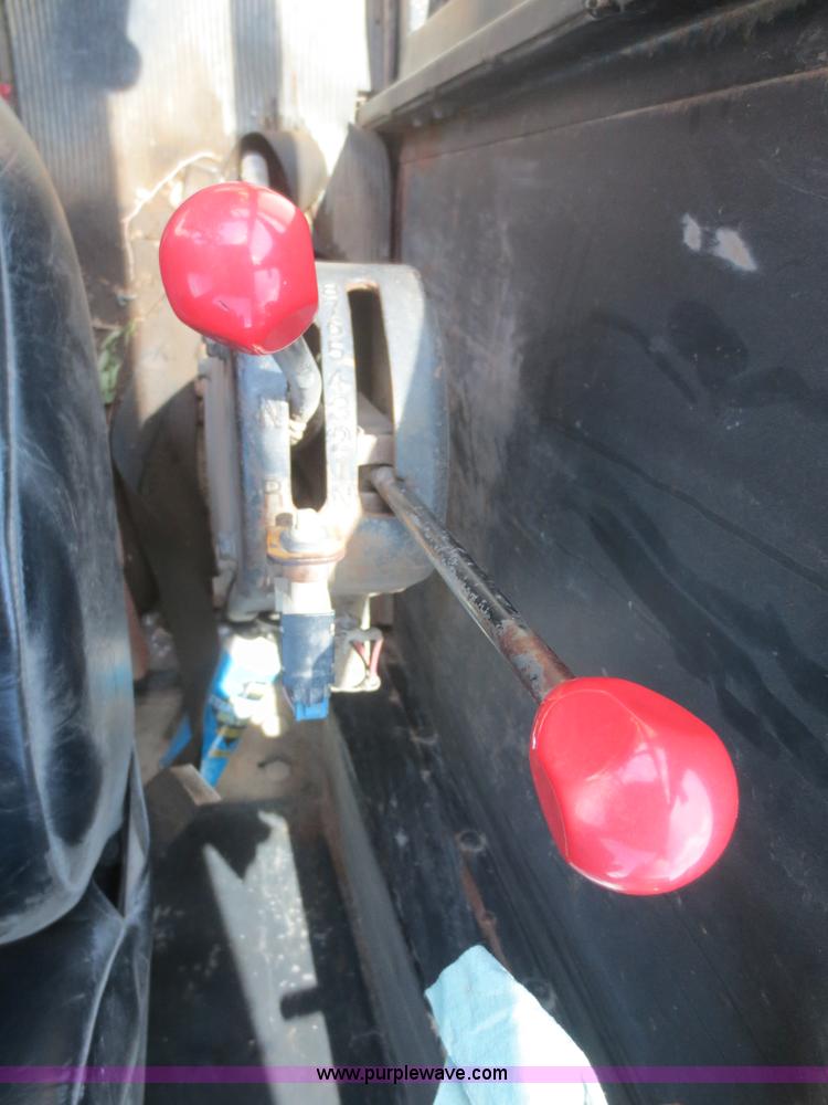 image for item F6999 1984 John Deere 570A articulated motor grader