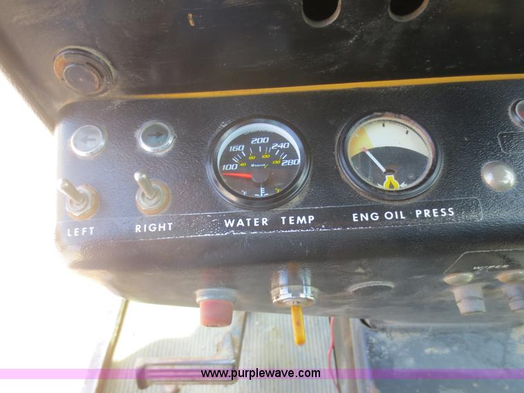 image for item F6999 1984 John Deere 570A articulated motor grader