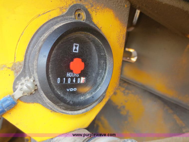 image for item F6999 1984 John Deere 570A articulated motor grader