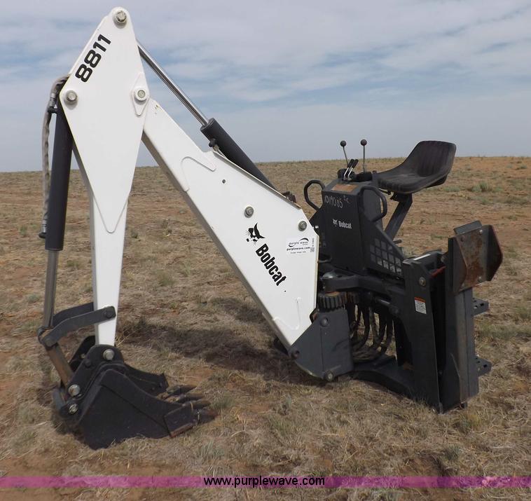 image for item H1895 Bobcat 8811 backhoe skid steer attachment