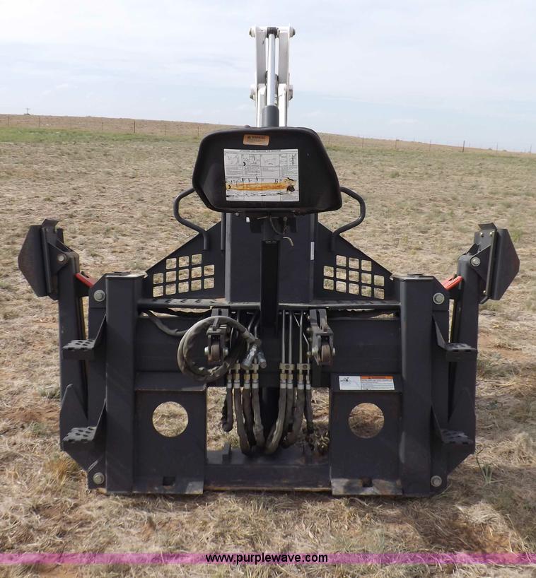 image for item H1895 Bobcat 8811 backhoe skid steer attachment
