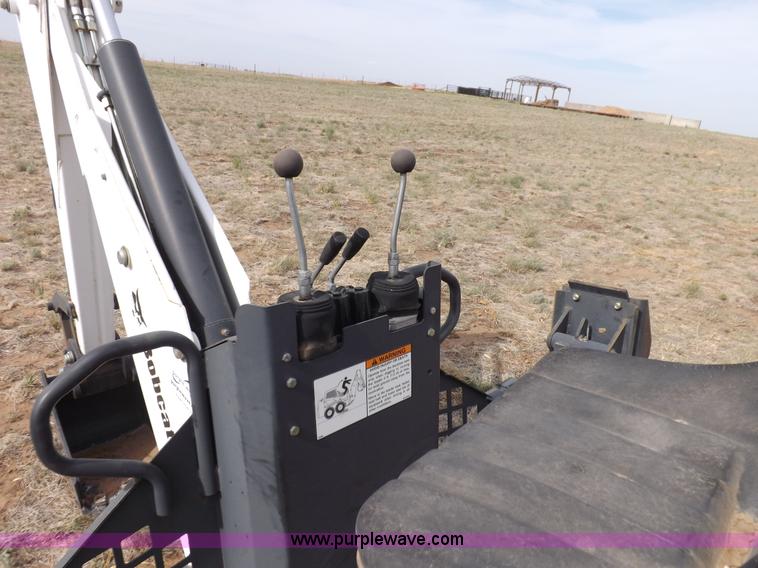 image for item H1895 Bobcat 8811 backhoe skid steer attachment