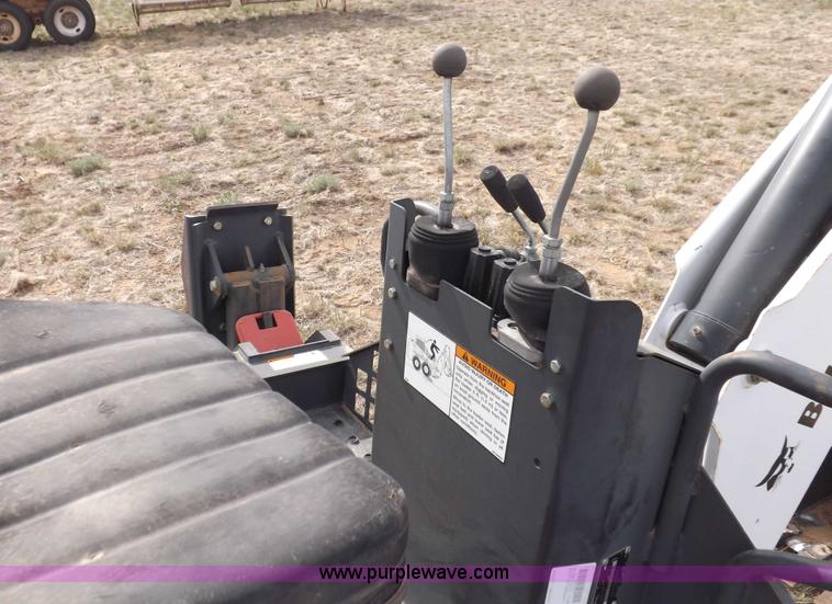 image for item H1895 Bobcat 8811 backhoe skid steer attachment