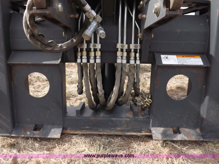 image for item H1895 Bobcat 8811 backhoe skid steer attachment