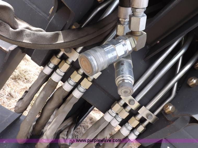 image for item H1895 Bobcat 8811 backhoe skid steer attachment