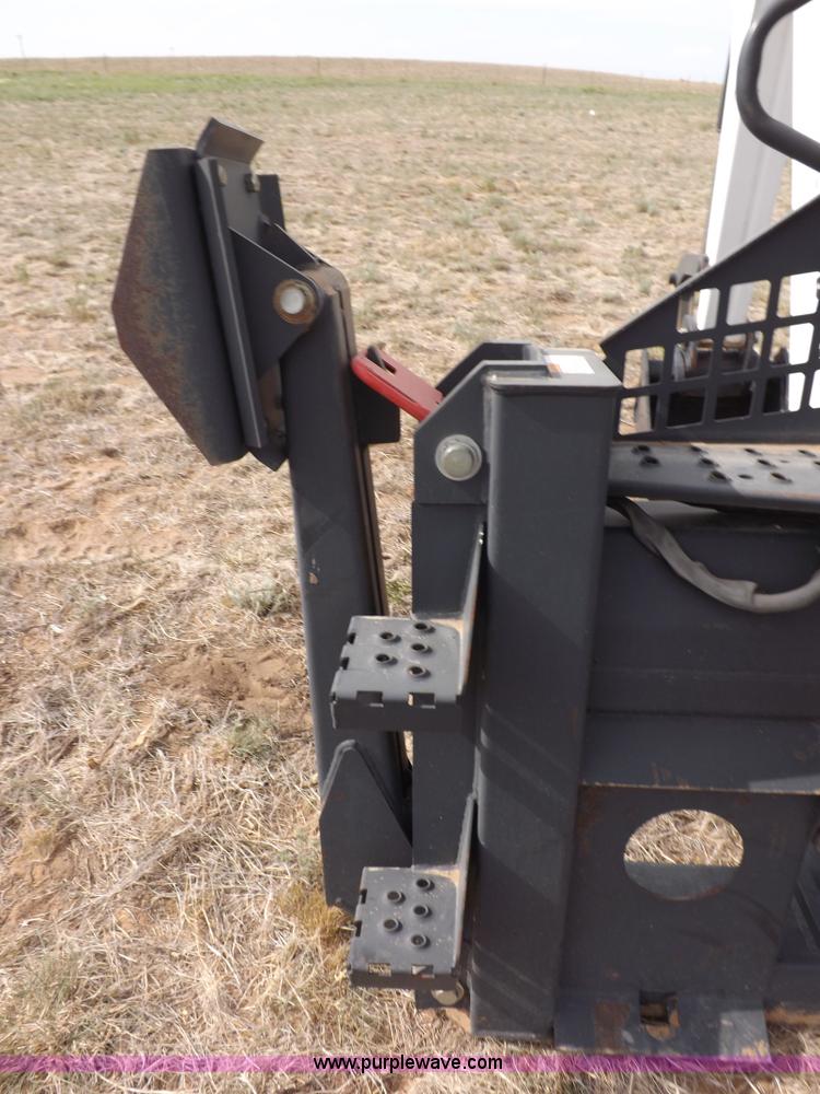 image for item H1895 Bobcat 8811 backhoe skid steer attachment