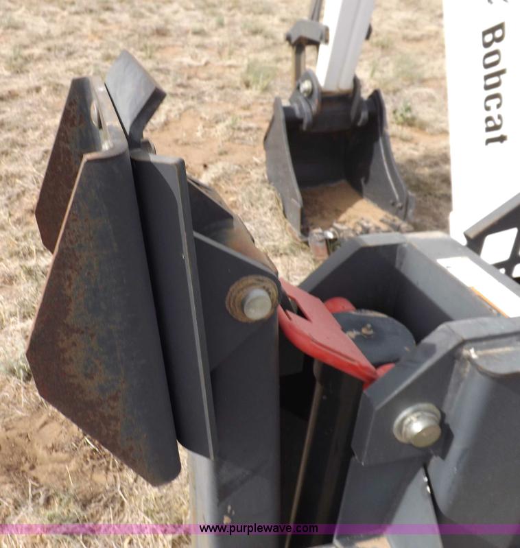 image for item H1895 Bobcat 8811 backhoe skid steer attachment