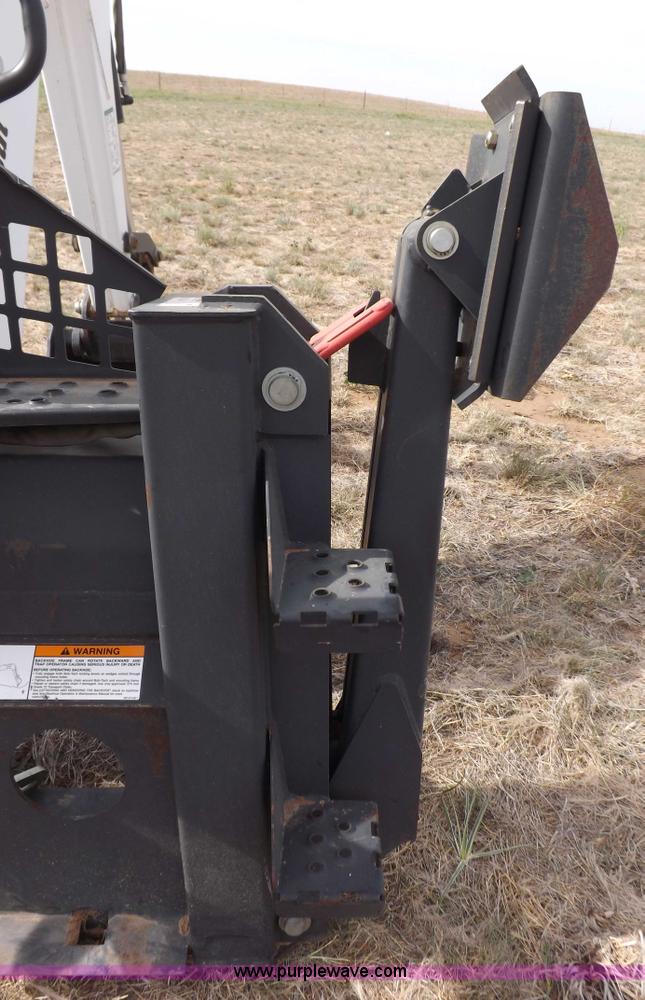 image for item H1895 Bobcat 8811 backhoe skid steer attachment