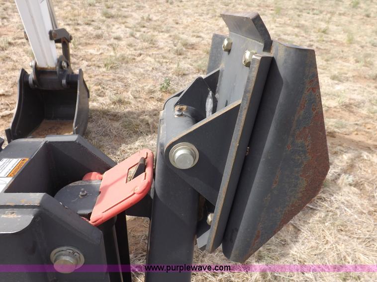 image for item H1895 Bobcat 8811 backhoe skid steer attachment