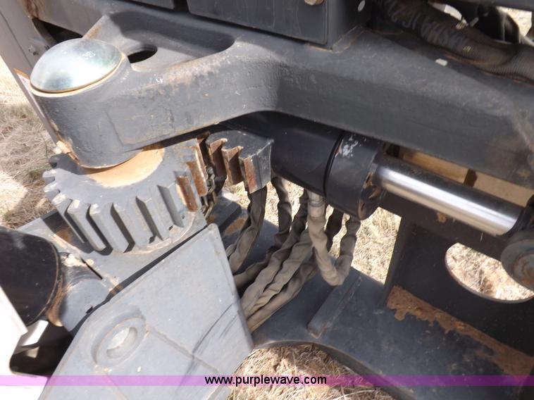 image for item H1895 Bobcat 8811 backhoe skid steer attachment