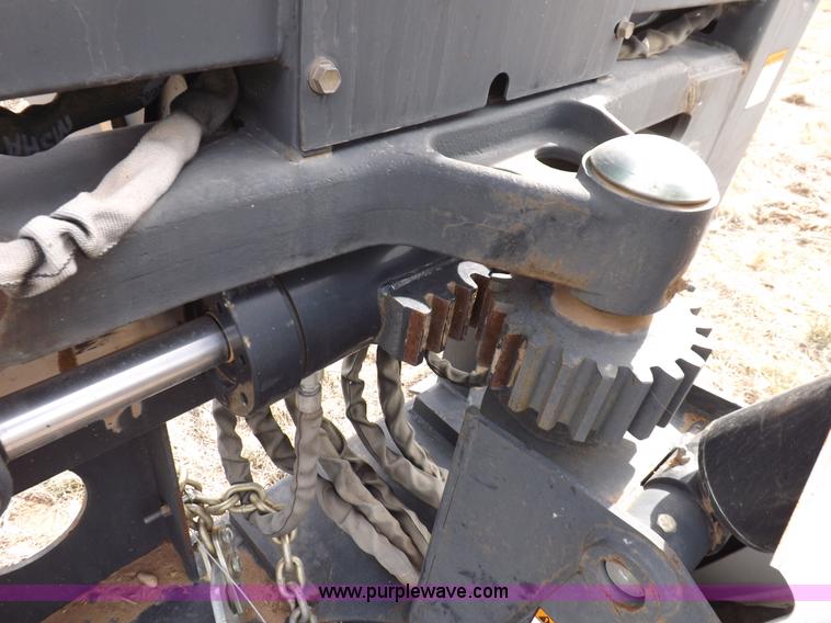 image for item H1895 Bobcat 8811 backhoe skid steer attachment