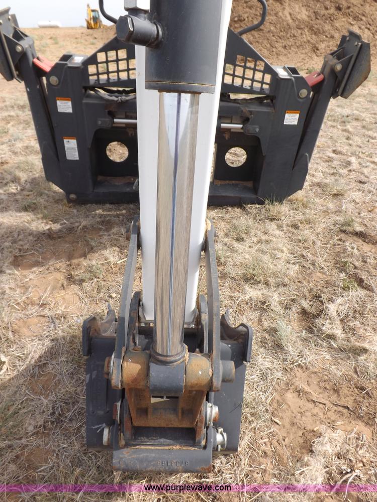 image for item H1895 Bobcat 8811 backhoe skid steer attachment