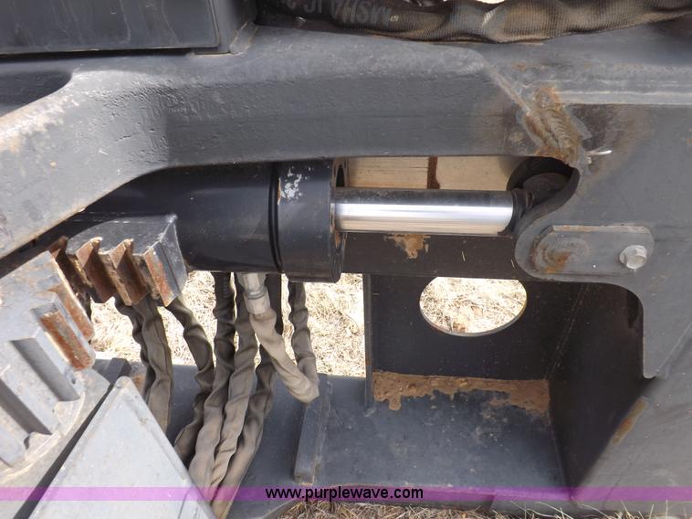 image for item H1895 Bobcat 8811 backhoe skid steer attachment