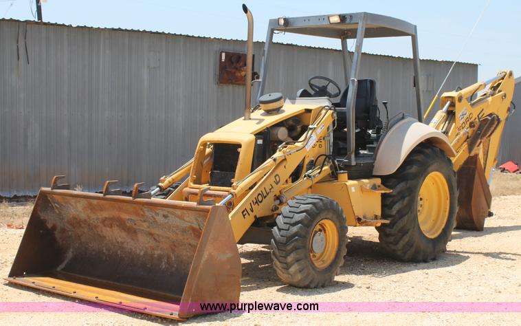image for item H2989 1998 New Holland 555E backhoe