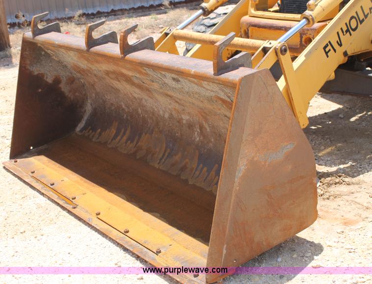 image for item H2989 1998 New Holland 555E backhoe