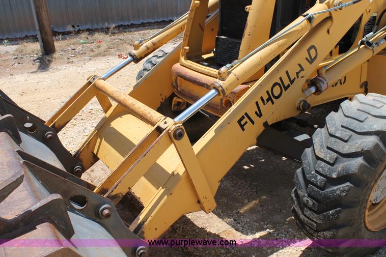 image for item H2989 1998 New Holland 555E backhoe