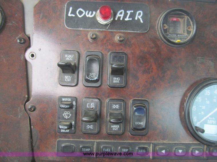 image for item H8999 1999 Freightliner FLC120 semi truck